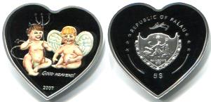 Heart shaped coin from Palau pictures angel and devil