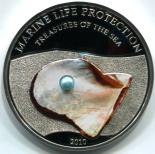 Palau 2010 silver proof 5 dollar coin containing a real pearl
